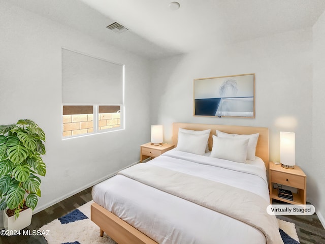 bedroom featuring dark wood-type flooring