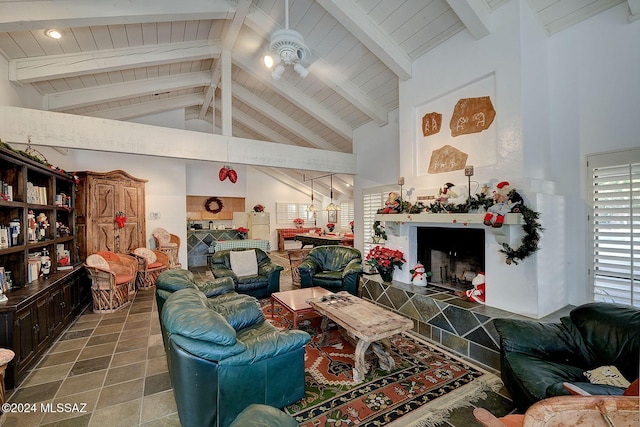 living room with beam ceiling and high vaulted ceiling