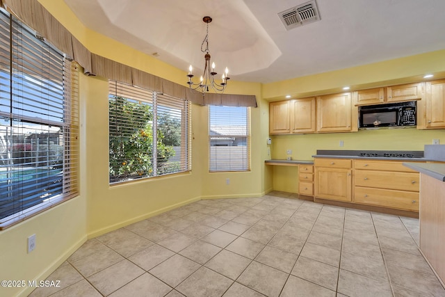 kitchen featuring light brown cabinets, an inviting chandelier, black appliances, hanging light fixtures, and light tile patterned floors