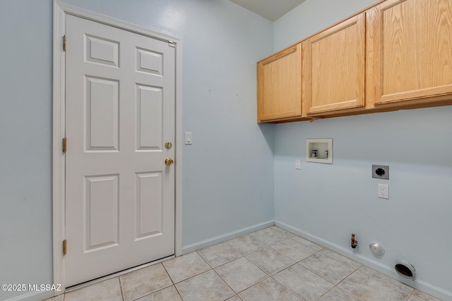 clothes washing area featuring cabinets, hookup for a gas dryer, hookup for a washing machine, light tile patterned floors, and hookup for an electric dryer