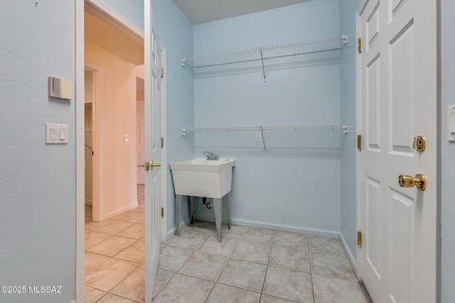 washroom with light tile patterned flooring