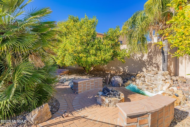 view of patio / terrace featuring a fire pit