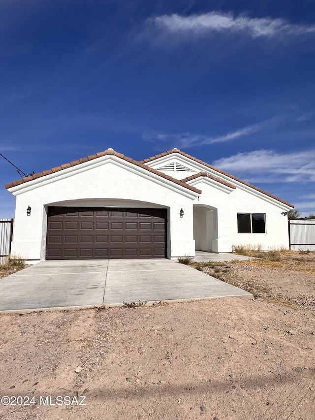 view of front of property with a garage