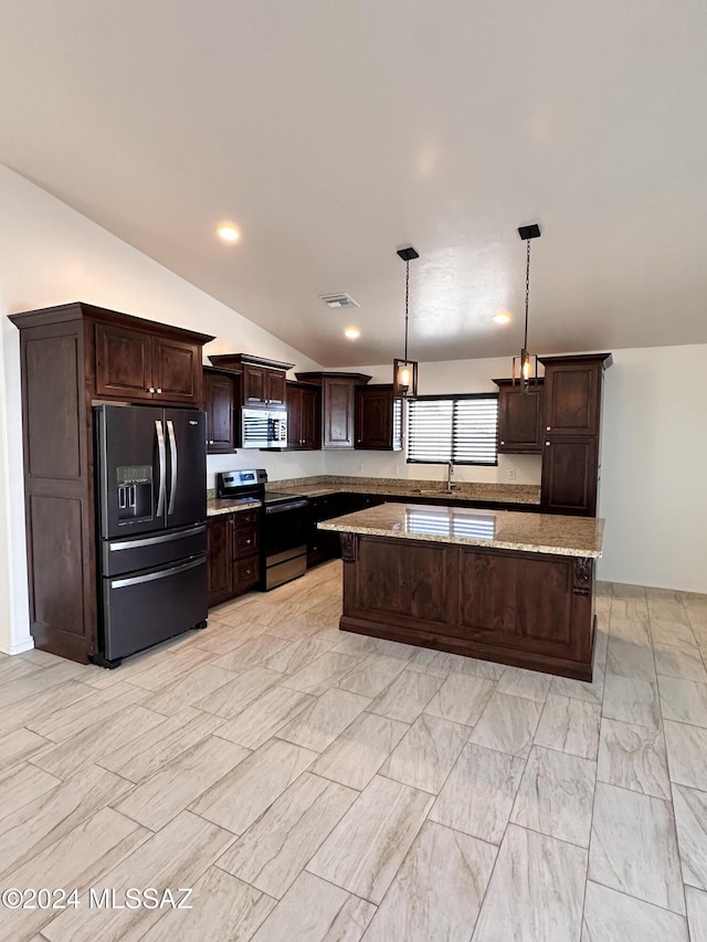 kitchen with stainless steel appliances, vaulted ceiling, decorative light fixtures, dark brown cabinets, and a kitchen island