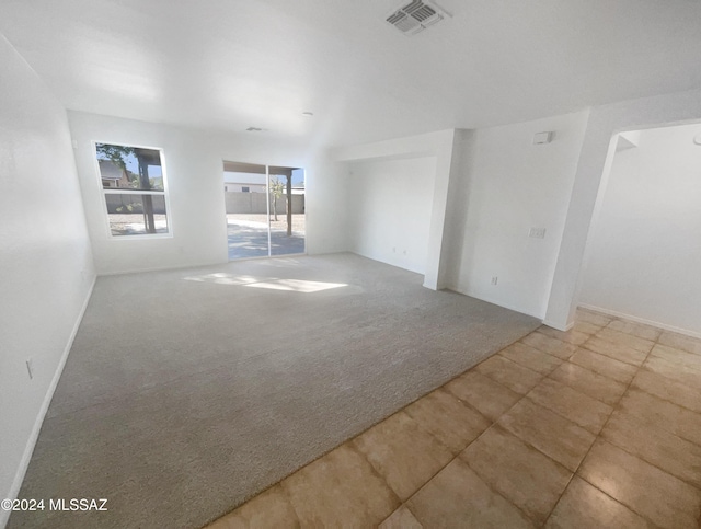 spare room featuring carpet floors