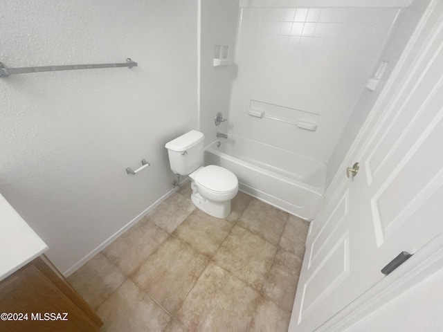 bathroom featuring bathtub / shower combination and toilet