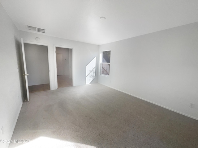 unfurnished room with carpet floors