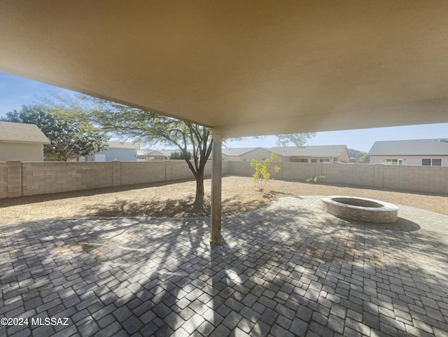 view of patio / terrace with an outdoor fire pit