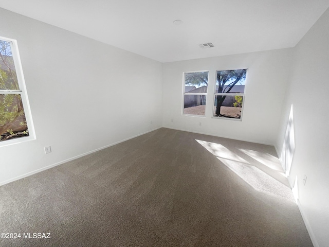 spare room featuring carpet