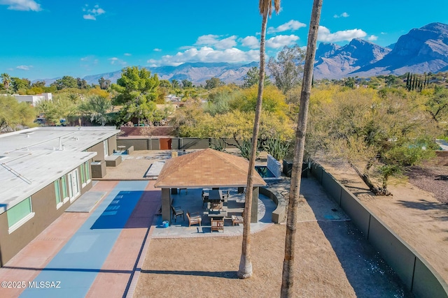 birds eye view of property featuring a mountain view