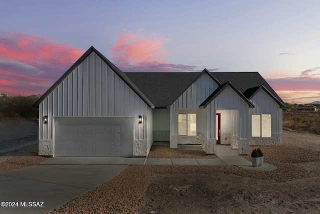 modern inspired farmhouse featuring a garage