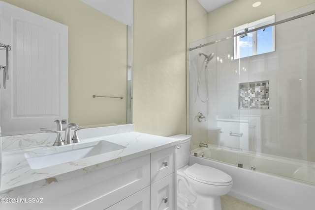 full bathroom featuring vanity, toilet, and enclosed tub / shower combo