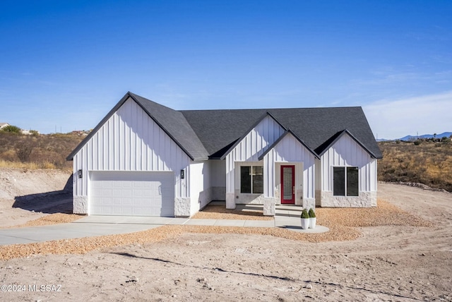 modern inspired farmhouse featuring a garage