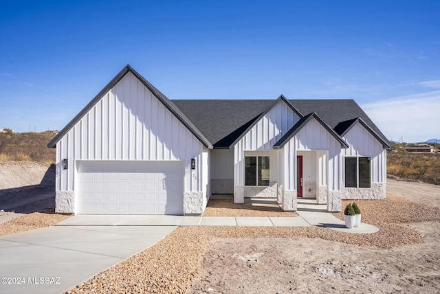 modern inspired farmhouse featuring a garage