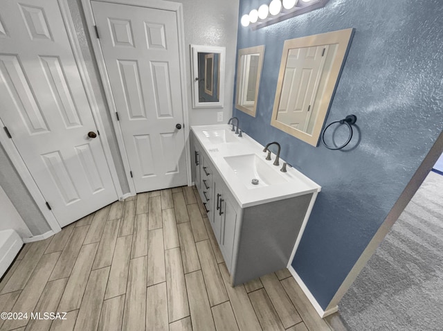 bathroom featuring hardwood / wood-style floors and vanity