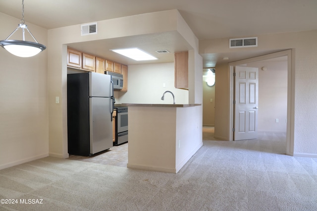 kitchen with light carpet, light brown cabinetry, appliances with stainless steel finishes, decorative light fixtures, and kitchen peninsula