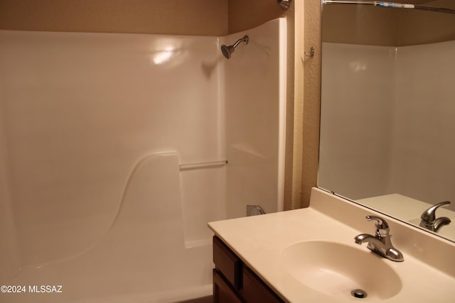 bathroom featuring vanity and walk in shower