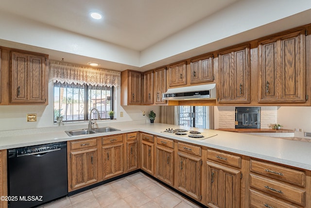 kitchen featuring dishwasher, sink, range hood, kitchen peninsula, and white cooktop