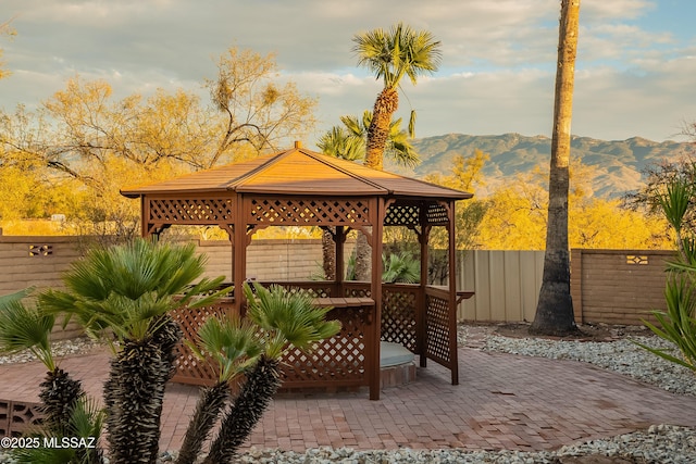 view of patio / terrace with a gazebo and a mountain view