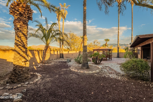 view of yard with a gazebo and a mountain view