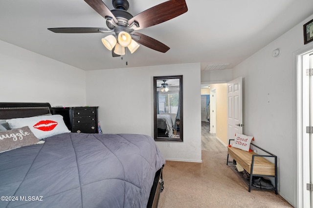 bedroom with ceiling fan and light colored carpet