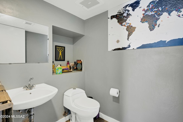 bathroom with sink and toilet