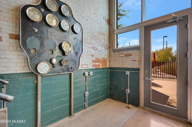 doorway to outside with brick wall