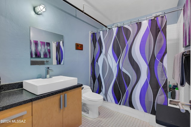 bathroom featuring vanity, a shower with curtain, tile patterned floors, and toilet