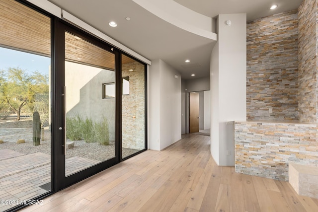 entryway featuring light hardwood / wood-style flooring and floor to ceiling windows