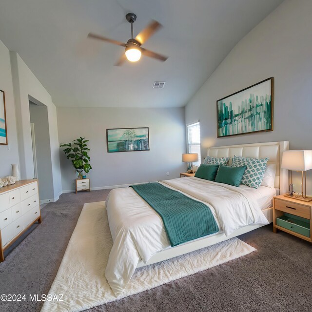 empty room featuring light carpet, ceiling fan, and lofted ceiling