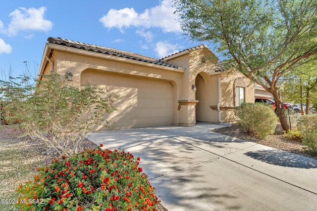 mediterranean / spanish-style house featuring a garage