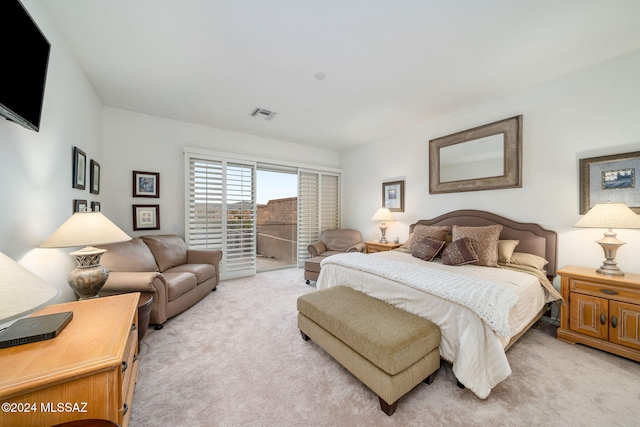 bedroom featuring light colored carpet