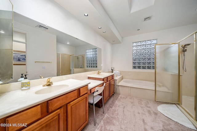 bathroom with vanity, plenty of natural light, and plus walk in shower