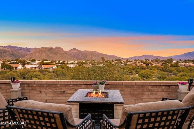 exterior space featuring a fire pit and a mountain view