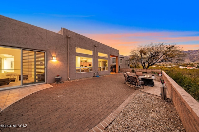 patio terrace at dusk with an outdoor hangout area