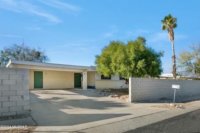 view of side of property with a carport