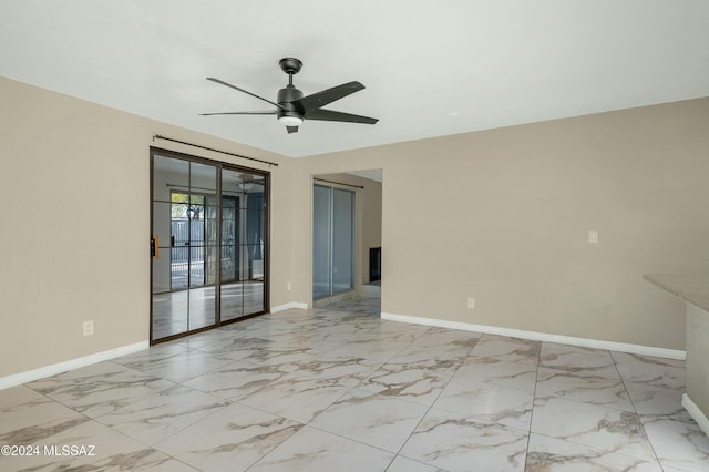 spare room with ceiling fan