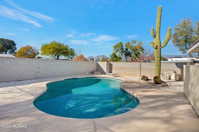 view of swimming pool featuring a mountain view