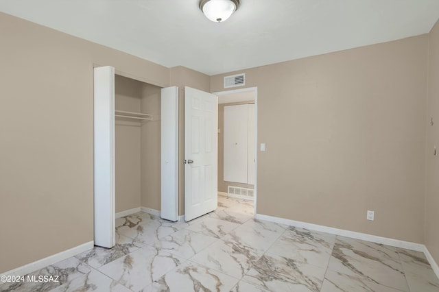 unfurnished bedroom featuring a closet