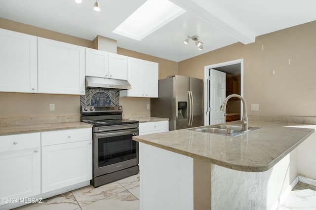 kitchen featuring white cabinets, sink, a skylight, light stone counters, and stainless steel appliances