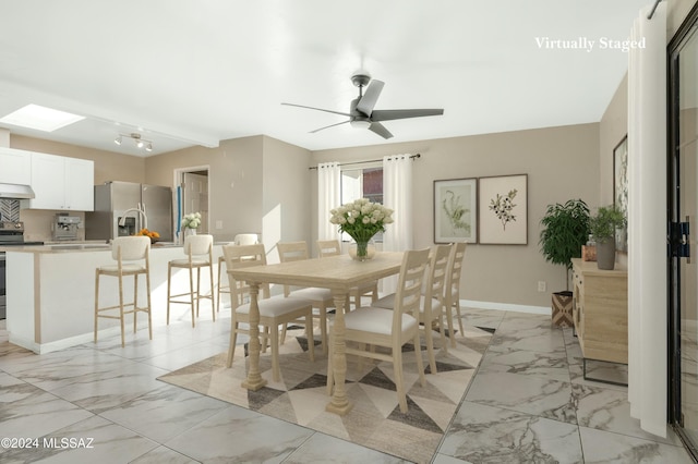 dining room featuring ceiling fan