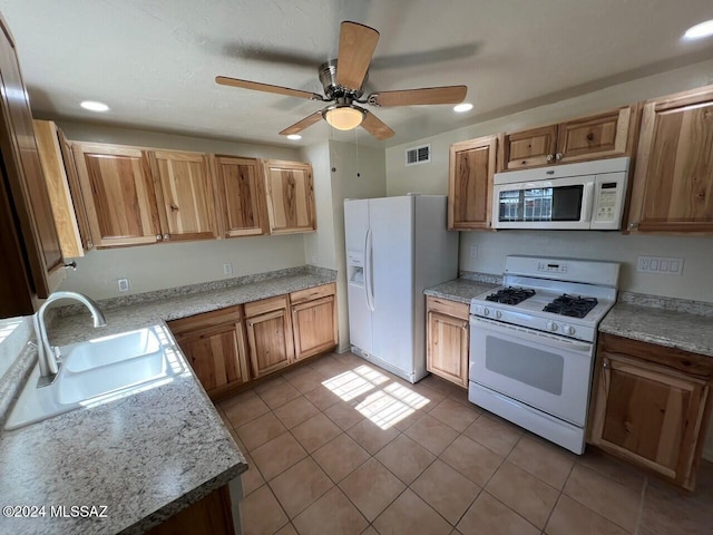 kitchen with sink, white appliances, ceiling fan, and light tile patterned flooring