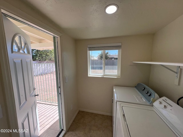 washroom featuring independent washer and dryer and light tile patterned floors