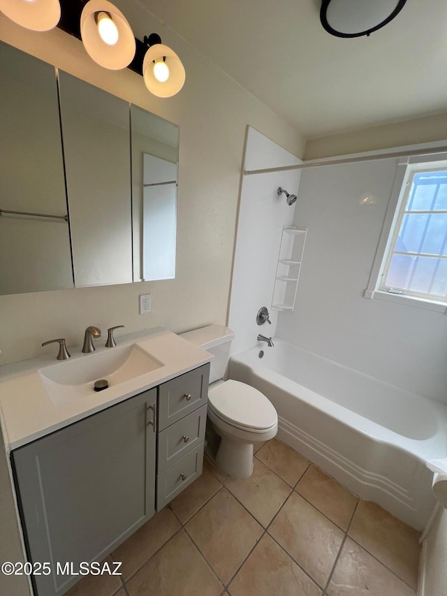 full bathroom featuring tile patterned flooring, vanity,  shower combination, and toilet