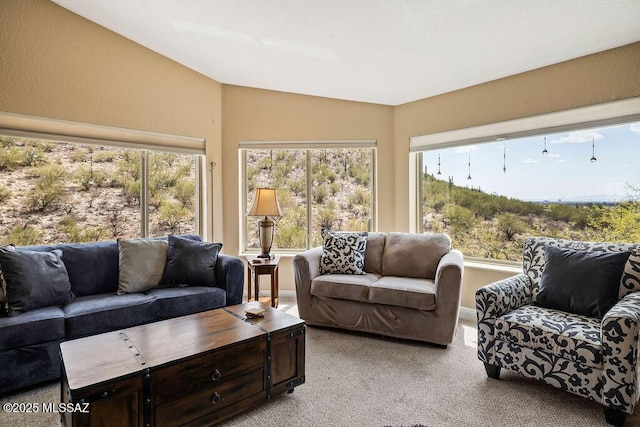 living area with light colored carpet and lofted ceiling