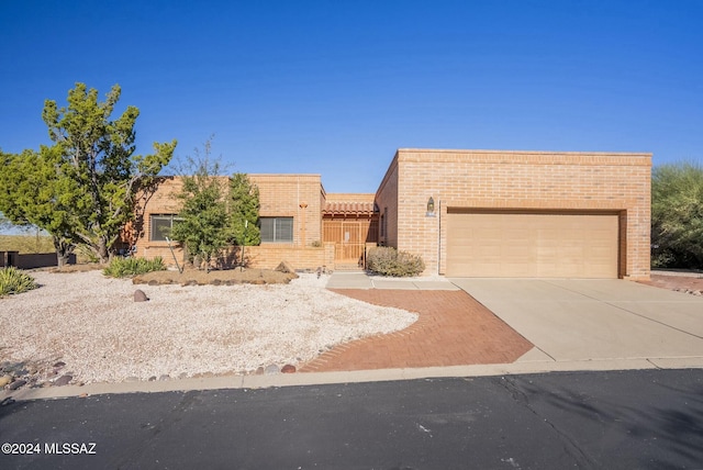 1800 W Camino Urbano, Green Valley, AZ 85622 - view of front facade featuring a garage