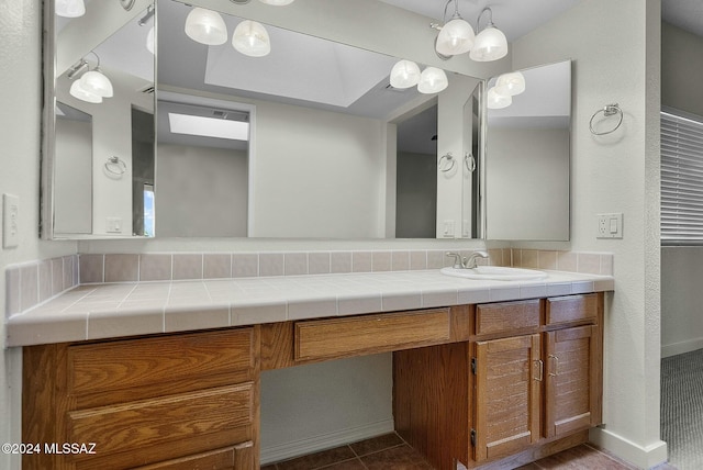 bathroom with tile patterned flooring and vanity