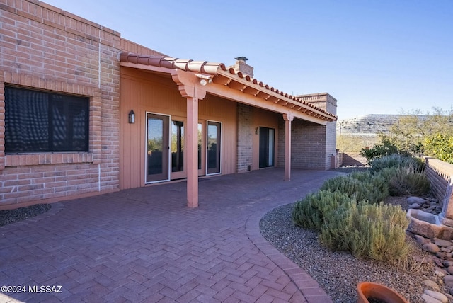 rear view of house featuring a patio