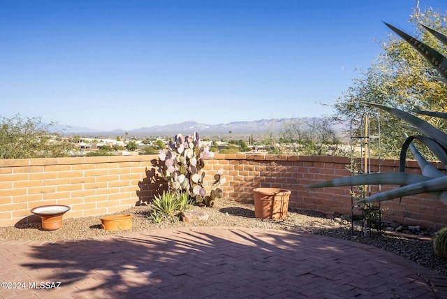 view of patio / terrace featuring a mountain view