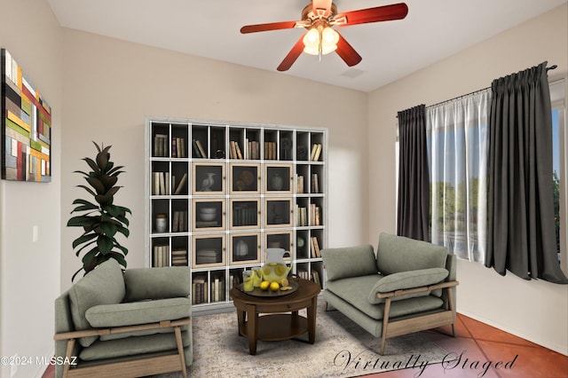 sitting room featuring ceiling fan